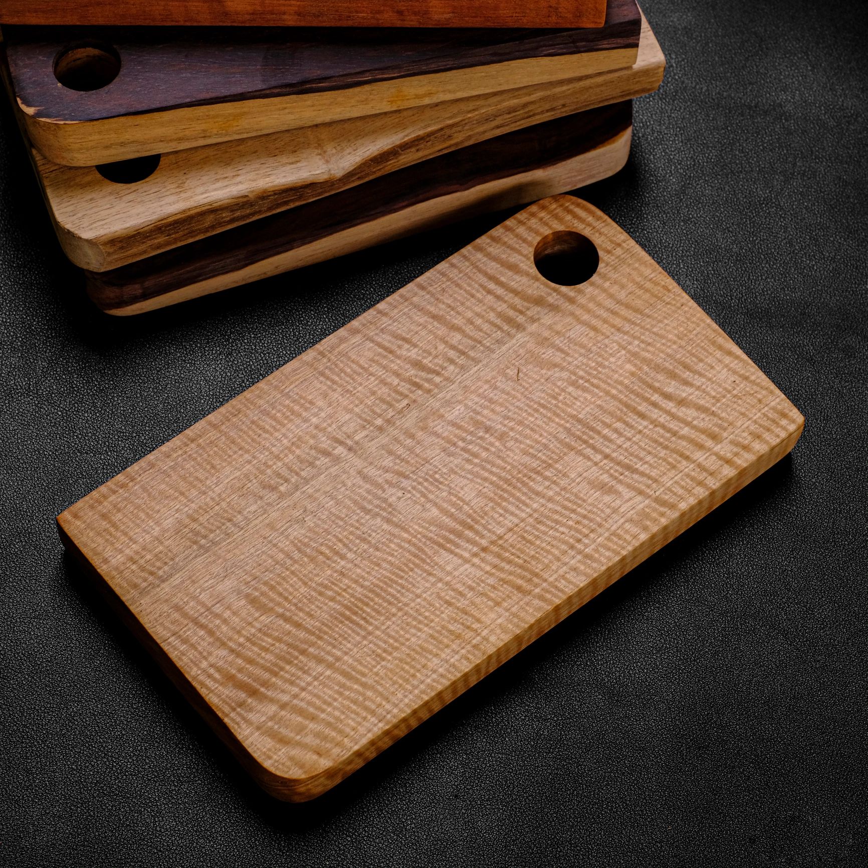 Maple and hardwood cutting board with bold striped contrast