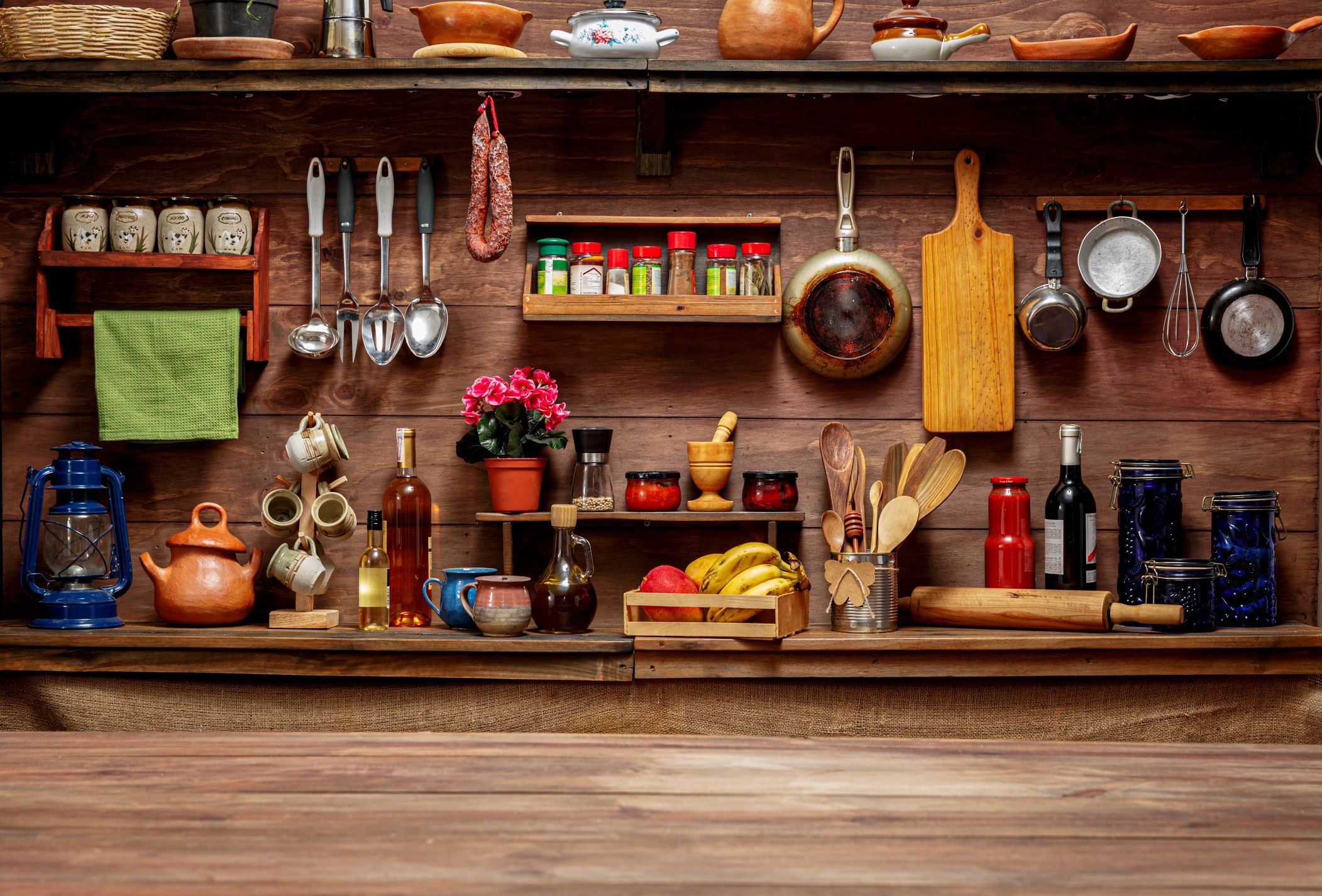 Rustic kitchen scene with cooking utensils and wooden surfaces
